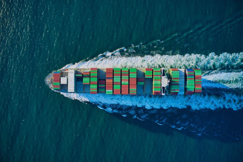 Container ship at sea, aerial view